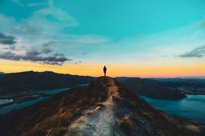 person standing on mountain